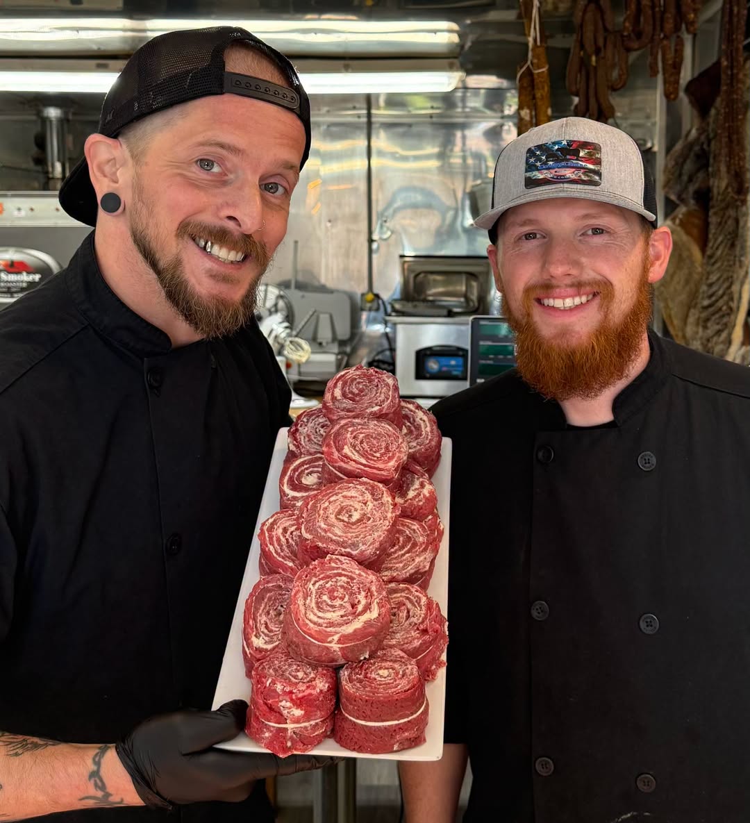 Two Harv’s butchers presenting flat-iron pinwheels